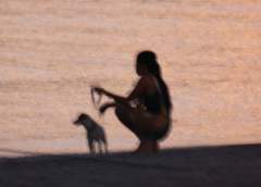 Lady with dog on the beach at sunset 001.jpg