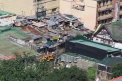 Ramshackle Rooftops and a Yellow Jeepney in Ermita, Manila