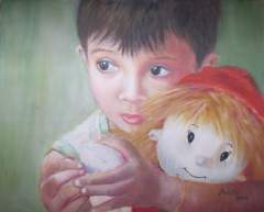 Wide-eyed young boy with his rag doll
