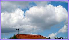 Blue Sky with Fluffy White Cumulous Clouds