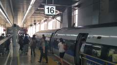 Passengers getting off a JR West N-500 Shinkansen train