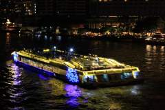 River boat all lit up at night on the Jao Praya River in Bangkok.jpg