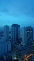 High-rise buildings near Manila Bay at dawn - the Hyatt Hotel and the Landmark Building