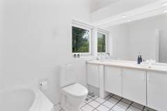White Danish bathroom with a white toilet