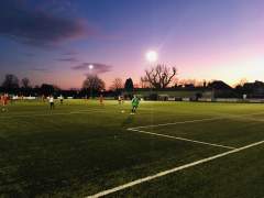Sunset, floodlights and football