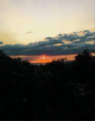 Orange sunset with dark clouds