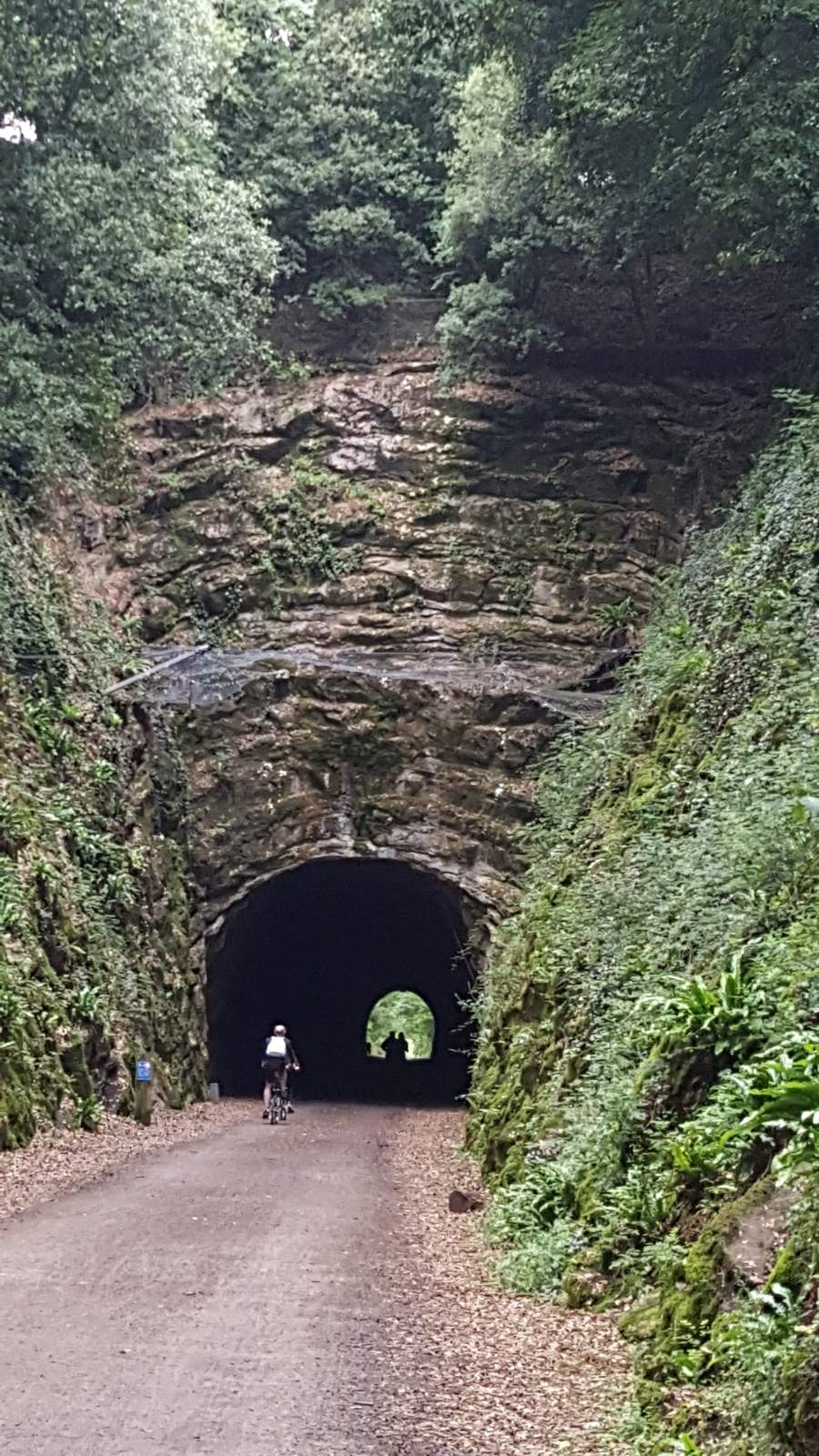A cyclist riding in to Shute Shelve Tunnel at the South Portal Cyclist